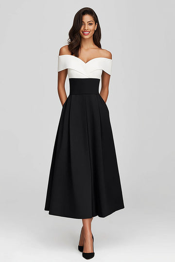Robe longue formelle en satin noir et blanc à épaules dénudées avec poches